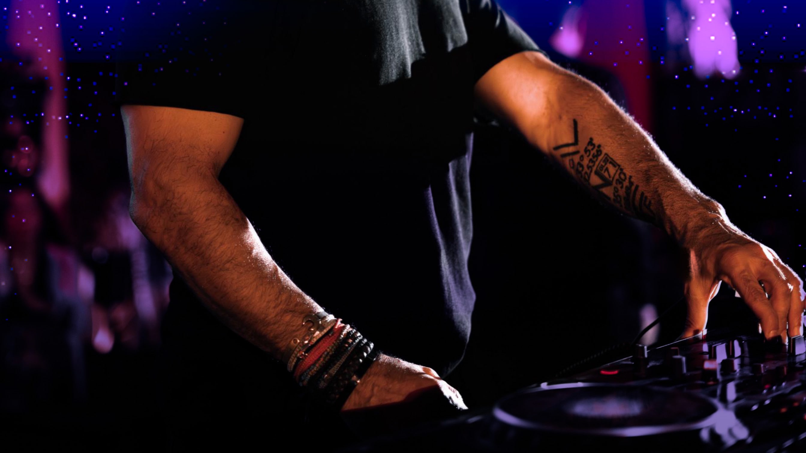 DJ RONN performing in Dubai with city skyline background